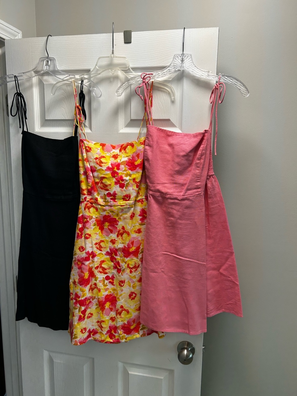 3 - Old Navy Pink, black and flower print sundresses with tie straps.